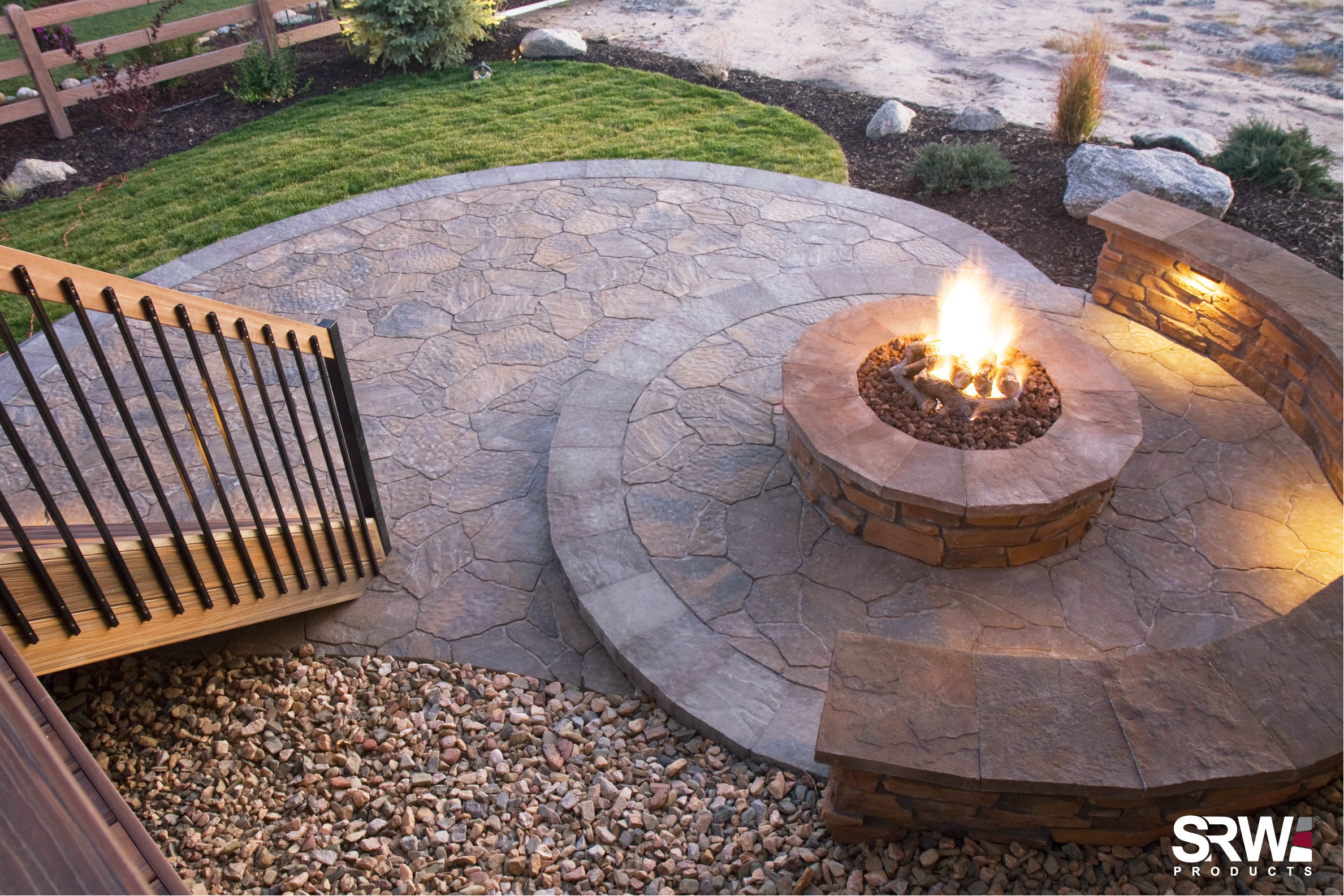 A finished outdoor patio and firepit hardscape project